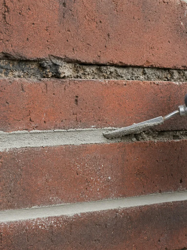 Tuckpointed chimney mortar joints, restored Fontana 1924 chimney